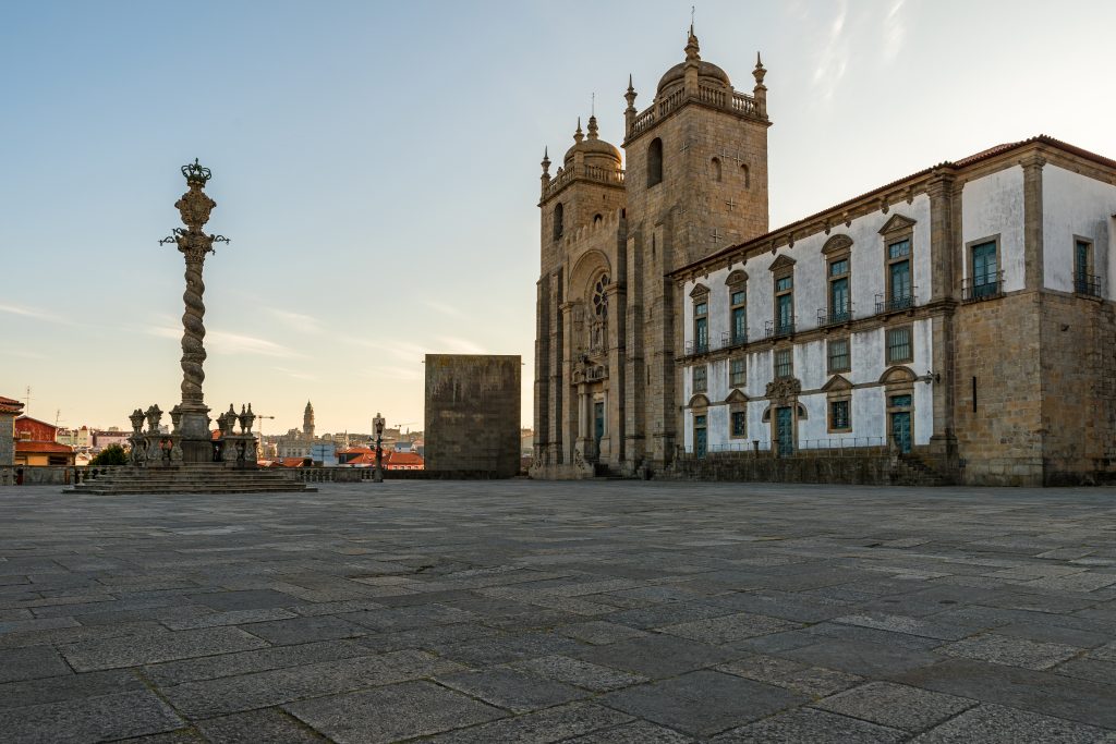 view on cathedral Se do Porto with Pillory of Porto from square at sunrise in the city center of Porto. Portugal with nobody