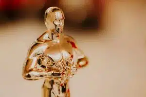 Nomination and Oscar reward concept. Golden statue for victory and success. Academy reward