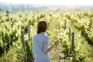 Woman tasting wine outdoors