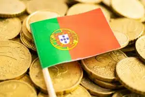 Portugal flag on coins money, finance and accounting, banking.