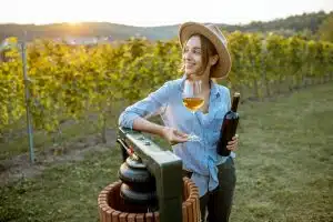 Woman tasting wine on the vineyard