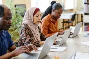 Migrants Students Using Laptops